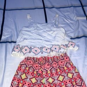 White top with colorful shorts romper